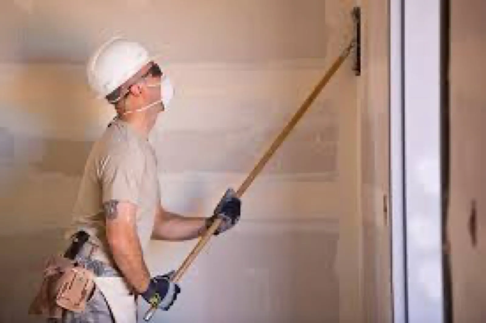 contractor working on drywall
